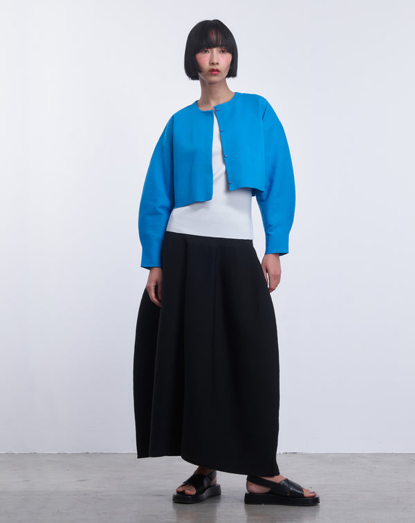VOLUMINOUS FLARED KNIT SKIRT