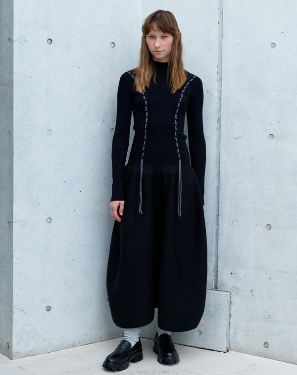 VOLUMINOUS FLARED KNIT SKIRT