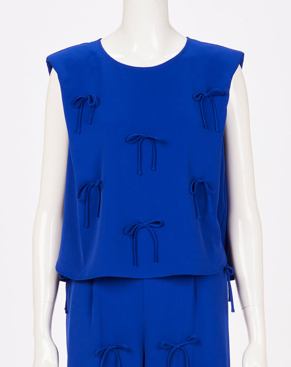 MULTI STRING BOW SLEEVELESS TOP