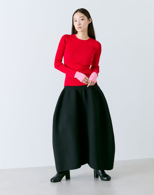 VOLUMINOUS FLARED KNIT SKIRT